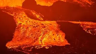 Lava flows out of the side of its channel, near crater 19 July 2021, Fagradalsfjall volcano ,Iceland