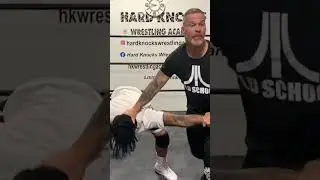 Pro wrestling catch wrestling working for cross arm submission