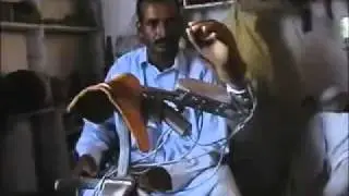 Artificial arm by illitrate man from Pakistan