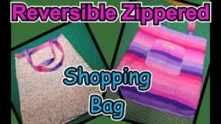 Fold-up zippered Shopping tote. Reversible, reuseable folding bag with pocket