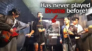 A person that has never played drums before decides to play drums in a studio session