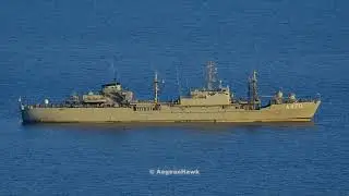 Hellenic Navy General Support Ship A470 HS Aliakmon lowering the Flag just before sunset.