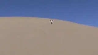 Emily Running Down a Dune