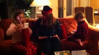 The elf giving the kids their stockings