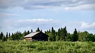 An abandoned house by a taiga river. A windowless hut. A hike along a northern river.