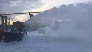 Снегоочиститель с автономным двигателем С2-250 АДГ на фронтальном погрузчике.