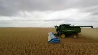 John Deere S660 with Shelbourne stripper front