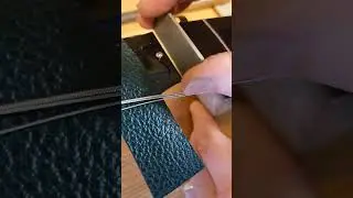 Cutting and fitting a bone nut to a Gibson guitar. 