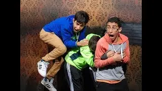 Funny faces of people scared to death in a haunted house