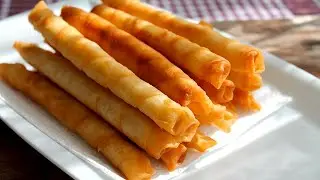 Turkish cuisine. Crispy cigar börek with cheese and ham. How to cook with Elena