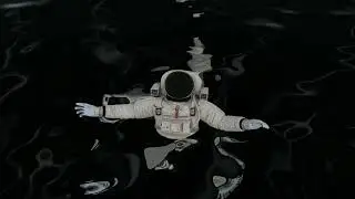 Astronaut floating in black space plasma. FREE 4K Background
