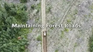 Installing water diversion bars and regrading forest logging roads