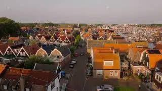 Tranquil beauty of Urk's charming residential neighborhood with its iconic lighthouse and dutch