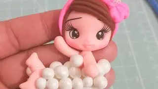 menina na banheira em biscuit