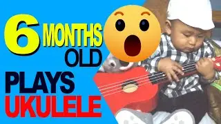 6 Months Old Baby Boy Playing Ukulele