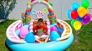 Egor and Dad play with inflatable toys