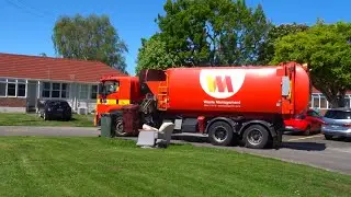 Waste Management Truck Drives The Wrong Way Around A Street: WM Side Loader Rubbish Truck - SL0059