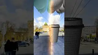 Launching a huge glass of coffee on balloons: tracking and simulation for a coffee shop