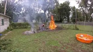 Setting fire to a brush pile and burning a snake.