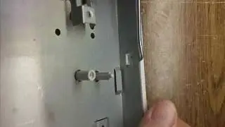 Removing microwave oven controller metal base