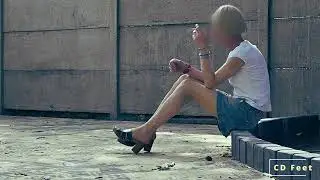 In wooden slippers