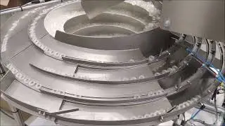 Bowl Feeder feeds and orientates Pharmaceutical Caps - RNA Automation Ltd