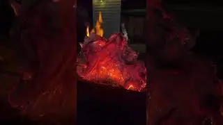 Fire behind burnt cardboard