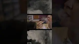 Emina smoking a cigar  