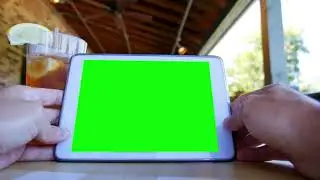 green screen tablet pc on a restaurant table