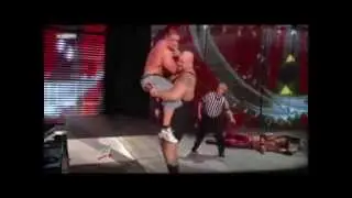 Big Show Chokeslams John Cena in a large spotlight