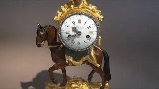 Gilt and Lacquered Bronze Clock “The Trotting Horse”, François VION Transition period