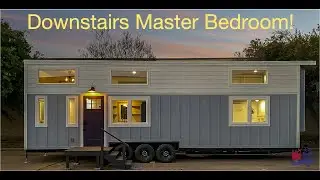 Downstairs master bedroom in this precious Tiny Home on Wheels