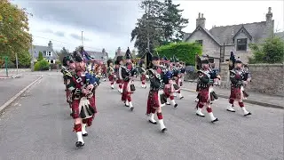 Military Bands lead Royal Guard Balaklava Company on the march back to barracks in Ballater, 2024