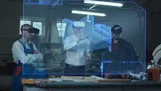 Workers and foreman usingvirtual reality headsets incarpentry workshop