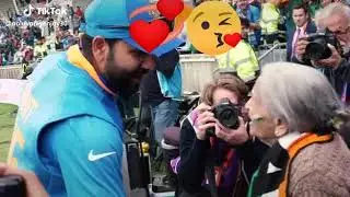 Old woman kissing Kohili