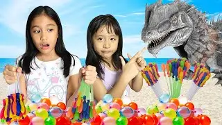 We FOUND BABY DINOSAURS & COLORFUL WATER BALLOONS with Daddy at the BEACH Pretend Play Ira & Bella