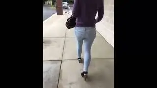 girl wetting pants on a supermarket parking lot