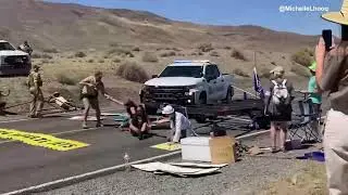 Burning Man 2023  Nevada Rangers plow truck through Extinction Rebellion protest after the activists