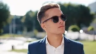 Young Businessman in Sunglasses Looking Sideways Outdoors | Stock Footage - Videohive