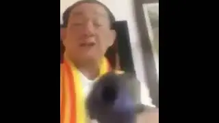 Angry Vietnamese man with gun singing