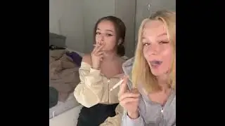 TWO SMALL GIRLS ARE SMOKING CIGARETTE'S 