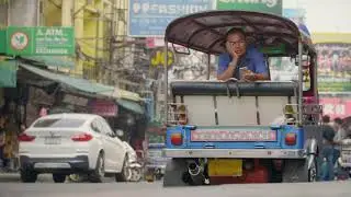 Tuk Tuk Driver Using Smartphone