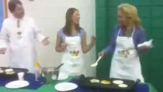 Janeé and Emily flip pancakes