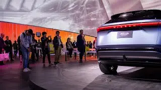 Visitors review the Nissan Ariya Concept: Nissan at CES 2020
