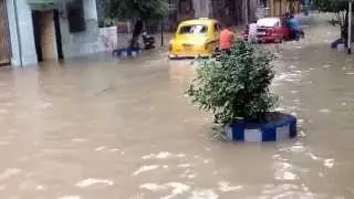 Cars are pushed out in flooded waterlogged streets in Kolkata during Monson 2nd August 2015