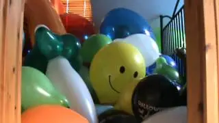 A big yellow smiley balloon goes pop