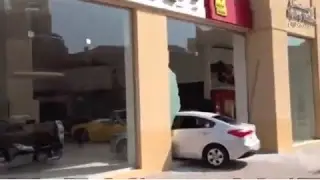 Drunk Drivers crashes into Ferrari dealer and RUNS AWAY