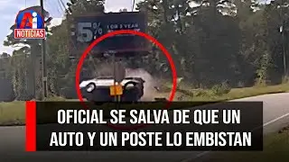 Oficial se salva de que un auto y un poste lo embistan | AI Noticias