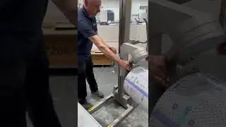 Roll Handling with Hinged Vertical Spindle Attachment and Manual Rotation