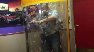 Dad in the ticket blaster at Chuck E. Cheese